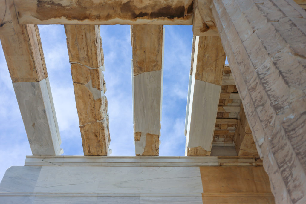 standing beneath ancient Greek ruins